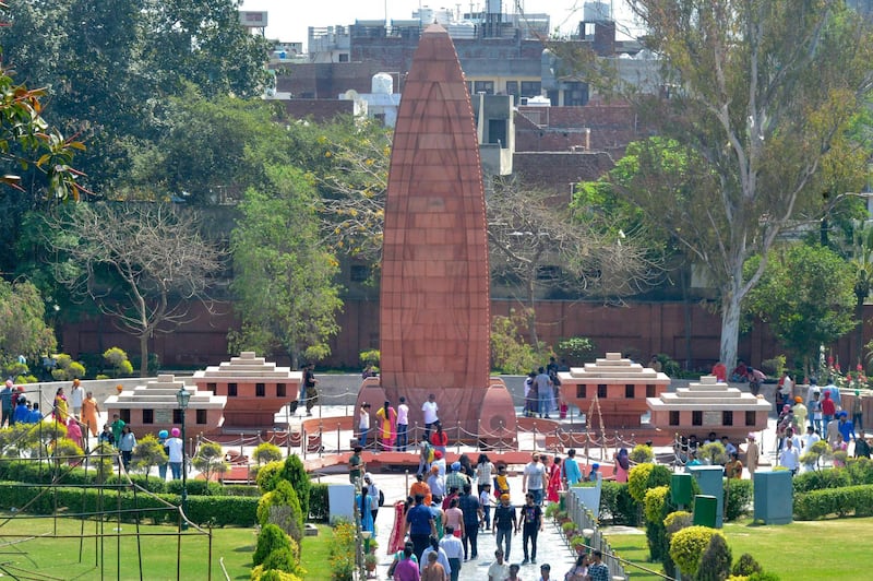 Indian visitors gather near the Jallianwala Bagh Martyrs' Memorial ahead of the 100th anniversary of the Jallianwala Bagh massacre in Amritsar on April 7, 2019.  The Amritsar massacre, also known as the Jallianwala Bagh Massacre, took place on April 13, 1919, when British Indian Army soldiers on the direct orders of their British officers opened fire on an unarmed gathering killing at least 379 men, women and children, according to official records.  / AFP / NARINDER NANU
