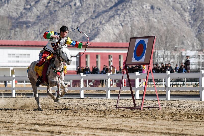 A man performs archery on a horse during a celebration on the third day of Losar, the Tibetan New Year, in Lhasa, Tibet. Reuters
