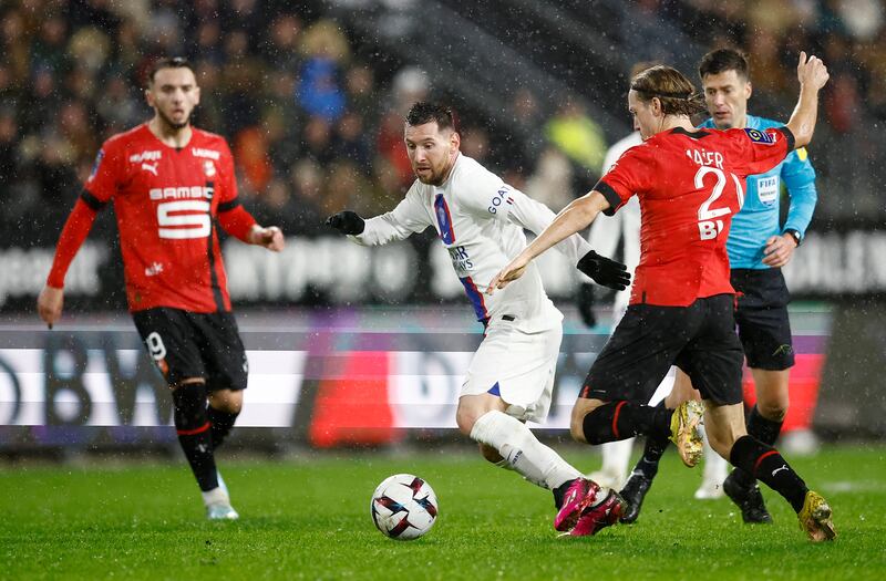 Lionel Messi evades Stade Rennes' Lovro Majer. Reuters