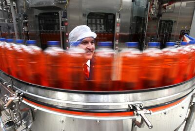Mark Jephcott viewing bottles of Irn Bru at AG Barr's Irn Bru factory in Cumbernauld. The compny struggled to make deliveries of its drinks due to the lorry driver and supply chain issues. PA
