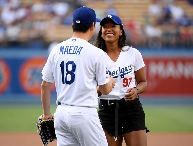 Osaka of Japan laughs with the LA Dodgers' Kenta Maeda. AFP