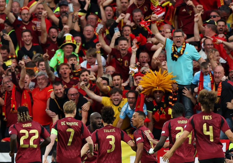 Belgium's Youri Tielemans celebrates scoring their first goal with teammates. Reuters 