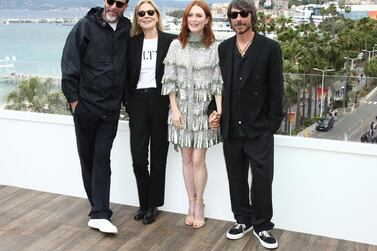 From left: director Luca Guadagnino with Marthe Keller, Julianne Moore and Pierpaolo Piccioli in Cannes. AP