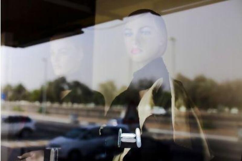 Fashion designers often replicate designs made by others. Above, a reflection of a mannequin in abaya. Lee Hoagland / The National