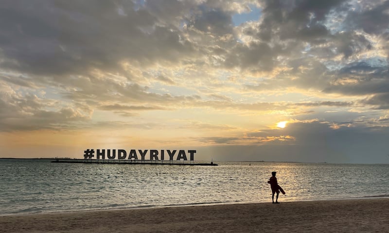 Lifeguard watches over the Hudayriyat beach amid the chilled weather in Abu Dhabi. Talib Jariwala / The National