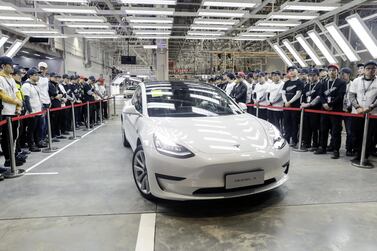 Tesla delivered 15 China-built Model 3 sedans to its employees in Shanghai on Monday. Bloomberg