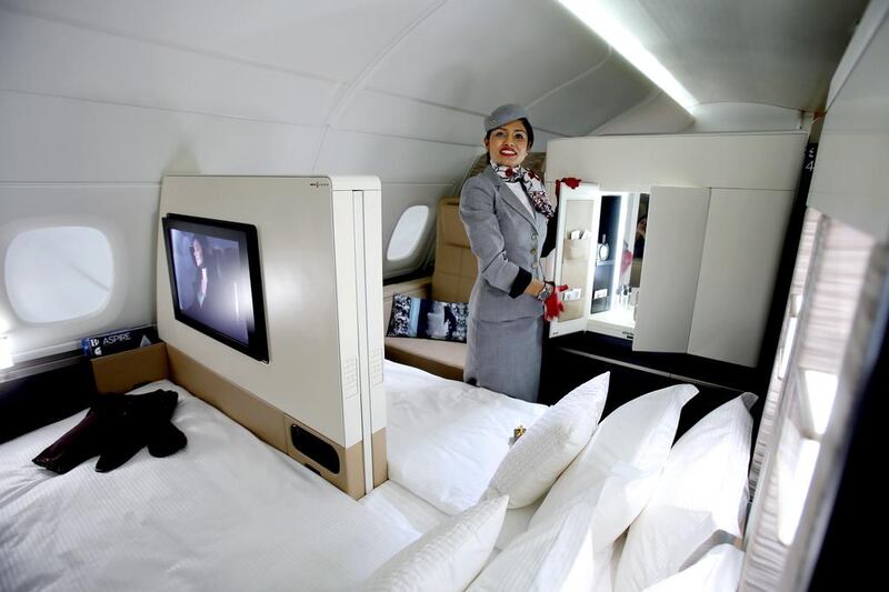 An Etihad Airways official stands inside a mock-up first class cabin, at a training facility in Abu Dhabi. Etihad Airways, a fast-growing Mideast carrier, laid out plans to offer passengers who find first-class seats a bit too tight a miniature suite featuring a closed-off bedroom, private bathroom and a dedicated butler. Kamran Jebreili / AP Photo