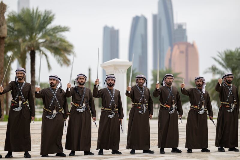 Emiratis perform a traditional dance during the state visit. Mohamed Al Blooshi for the UAE Presidential Court