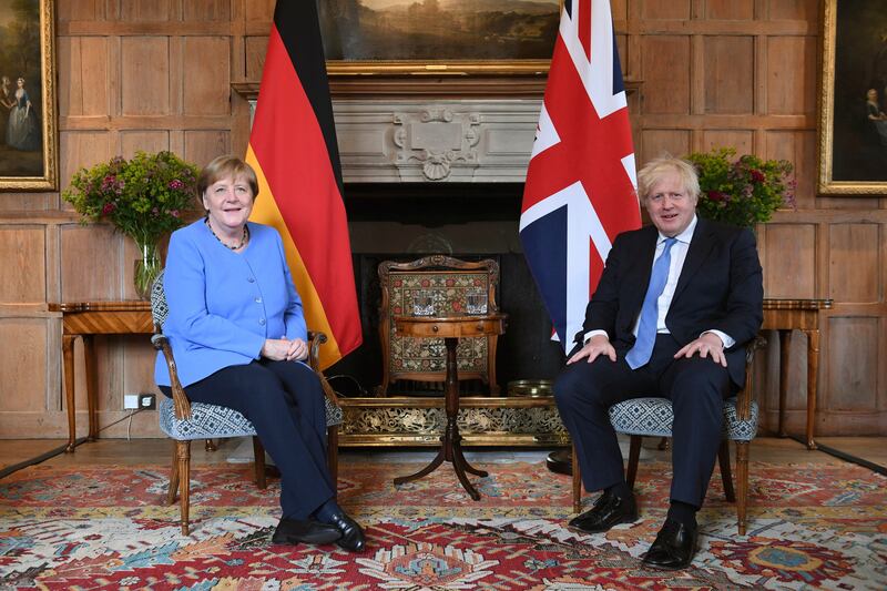 German Chancellor Angela Merkel meets Britain's Prime Minister Boris Johnson at Chequers in Buckinghamshire, England. AP