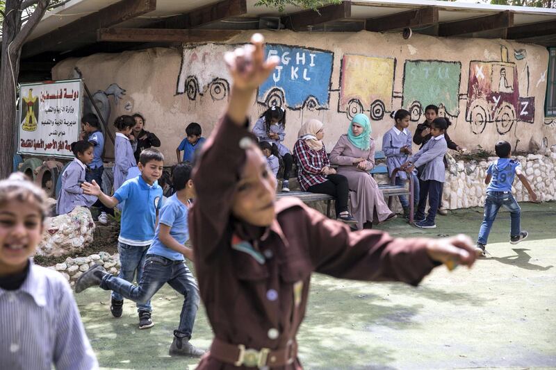 Beduin children at the elementary school in the tiny West Bank Beduin village of Khan al-Ahmar  on May 2,2018.The Israeli Supreme Court is expected next week to rule on the fate of the village, situated east of Jerusalem between the expanding settlements of Maale Adumim and Kfar Adumim.  The Israeli state says Khan al-Ahmar must be leveled because its structures are situated on state land and were built without permits, which are nearly impossible to obtain in the part of the West Bank known as area C, under full Israeli control.(Photo by Heidi Levine for The National).