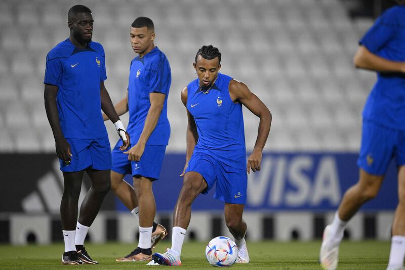 Jules Kounde takes part in a France training session at Al Janoub Stadium. AFP