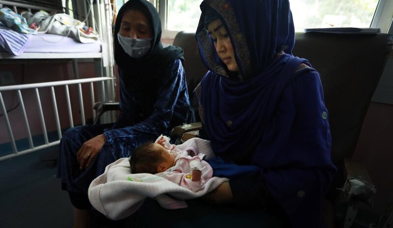 A rescued mother and her newborn baby take medical care in a hospital after the complex attack at MSF hospital, in Kabul, Afghanistan.  EPA