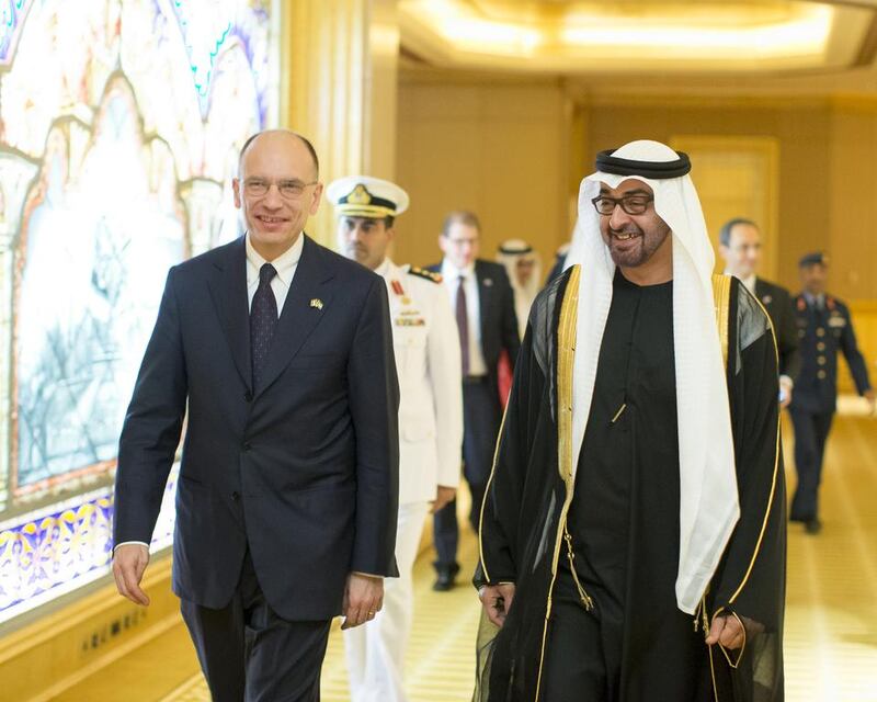 Abu Dhabi’s Crown Prince, right, walking with the Prime Minister of Italy, Enrico Letta, left, after a meeting at Emirates Palace. Ryan Carter / Crown Prince Court - Abu Dhabi