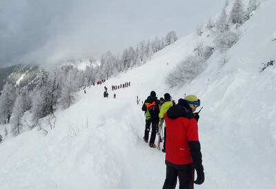 Rescuers during their mission on a slope near Pill, western Austria, on February 4. AFP