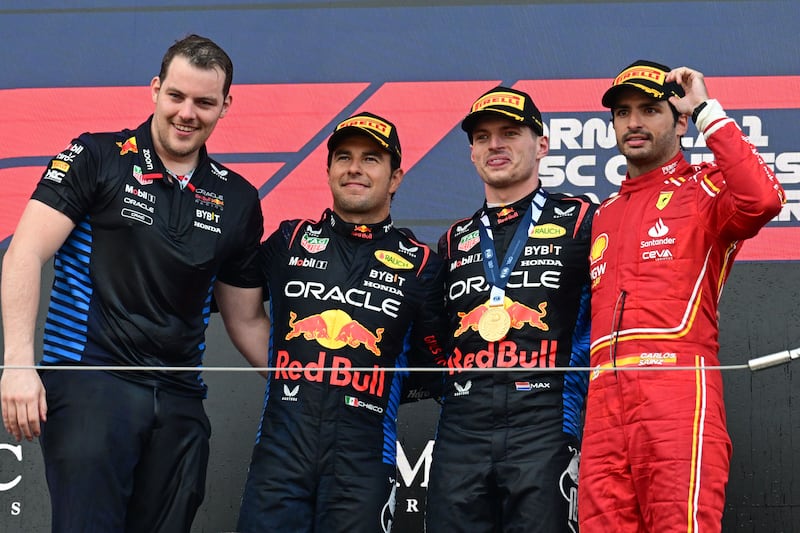 Red Bull race winner Max Verstappen, second right, with second-placed Sergio Perez, second left, and Carlos Sainz. AFP