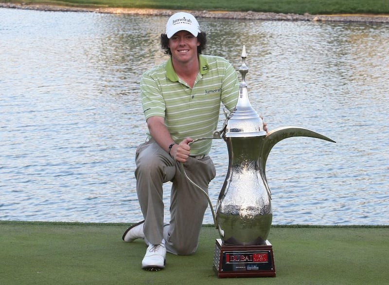 Rory McIlroy with the giant coffee pot trophy after winning the 2009 Omega Dubai Desert Classic at Emirates Golf Club. Jeffrey E Biteng / The National

