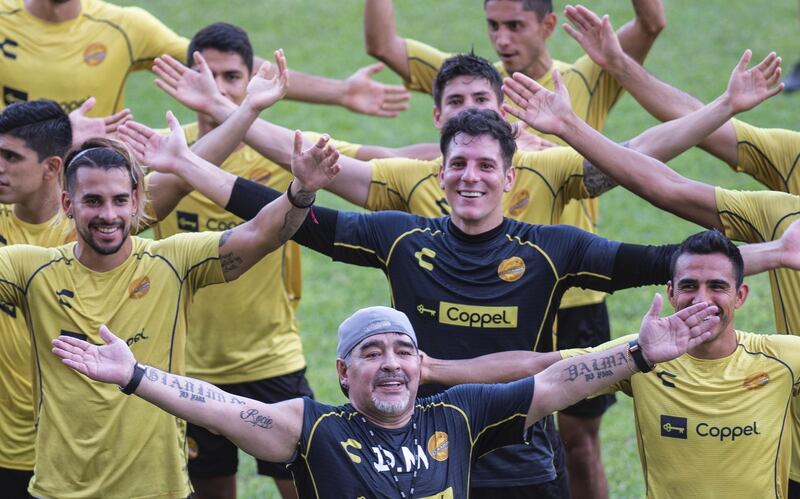 Diego Maradona gestures with the players during his first training session as coach of Mexican football club Dorados, at the Banorte stadium in Culiacan, Sinaloa State, Mexico. Pedro Pardo/AFP