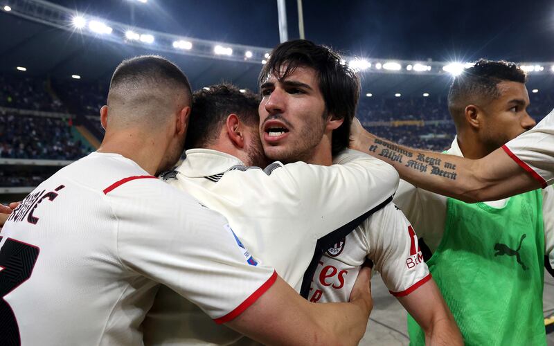 Milan's Sandro Tonali celebrates with teammates after scoring to make it 2-1. EPA