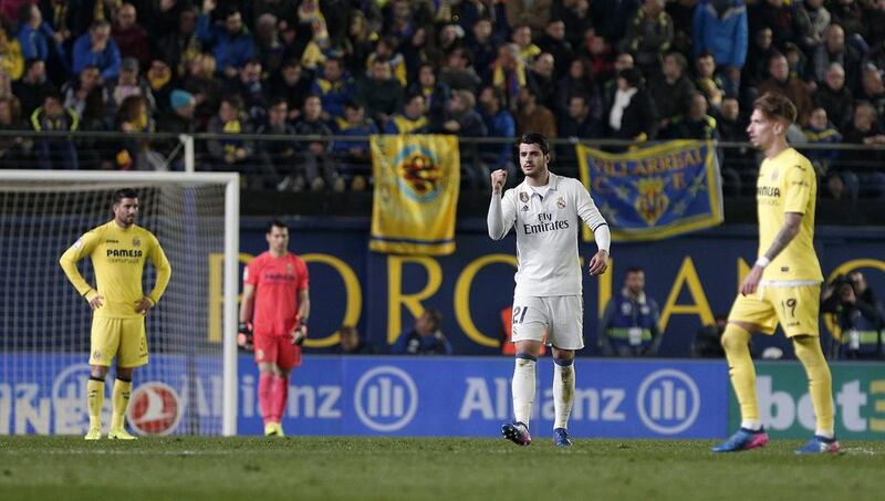 Real Madrid substitute Alvaro Morata, second right, celebrates after scoring the winner in a 3-2 triumph against Villarreal. Miguel Angel Polo / EPA