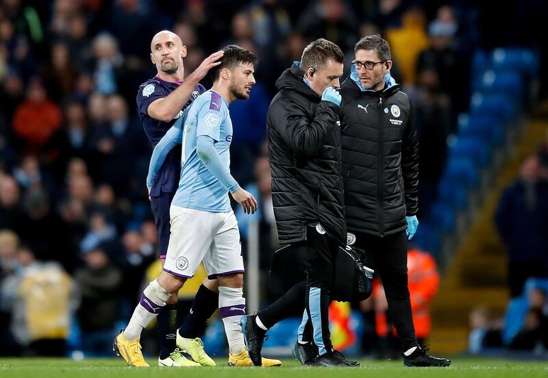 Manchester City's David Silva leaves the pitch with a suspected injury. PA