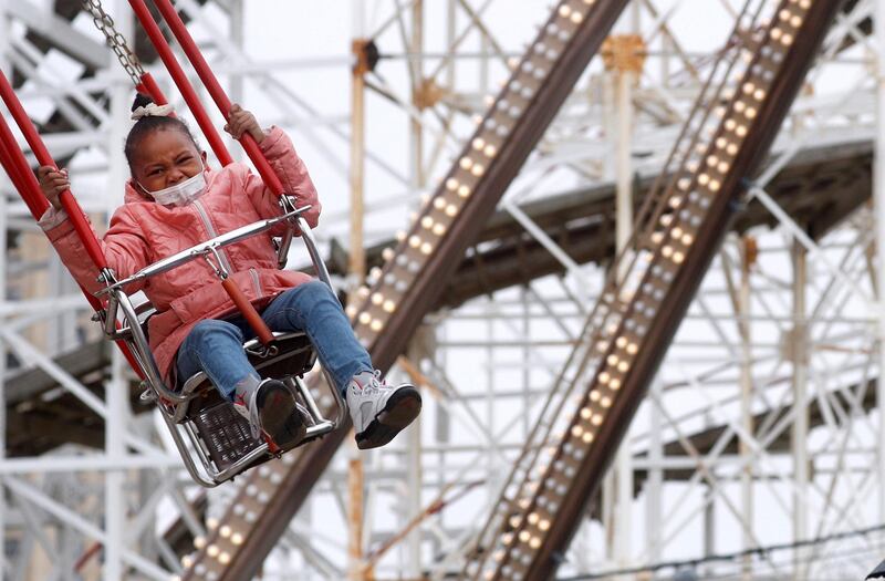 A guest enjoys a ride at Luna Park on the first day of the Coney Island parks reopening, during the coronavirus disease pandemic, in the Coney Island neighborhood of Brooklyn, New York, U.S. Reuters