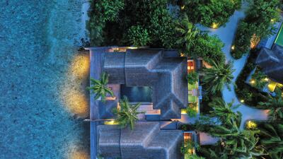 Villas are flanked by lush greenery. Photo: Naladhu Private Island
