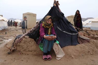 An Afghan girl  at her temporary shelter provided by the United Nations High Commissioner for Refugees. There are now more than 70 million people displaced in the world. Jalil Rezayee /  EPA