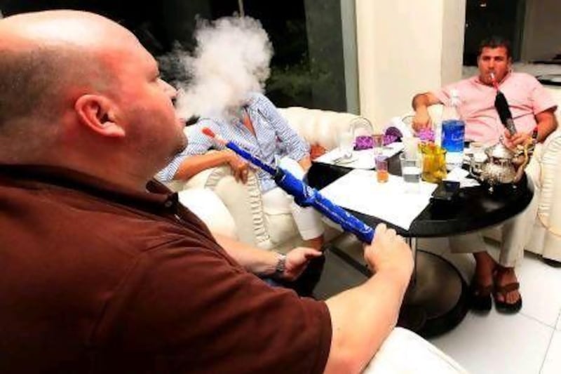 People enjoying Sheesha at the Lounge Wish in Dubai, venues such as this will now have to display signs warning about passive smoking.