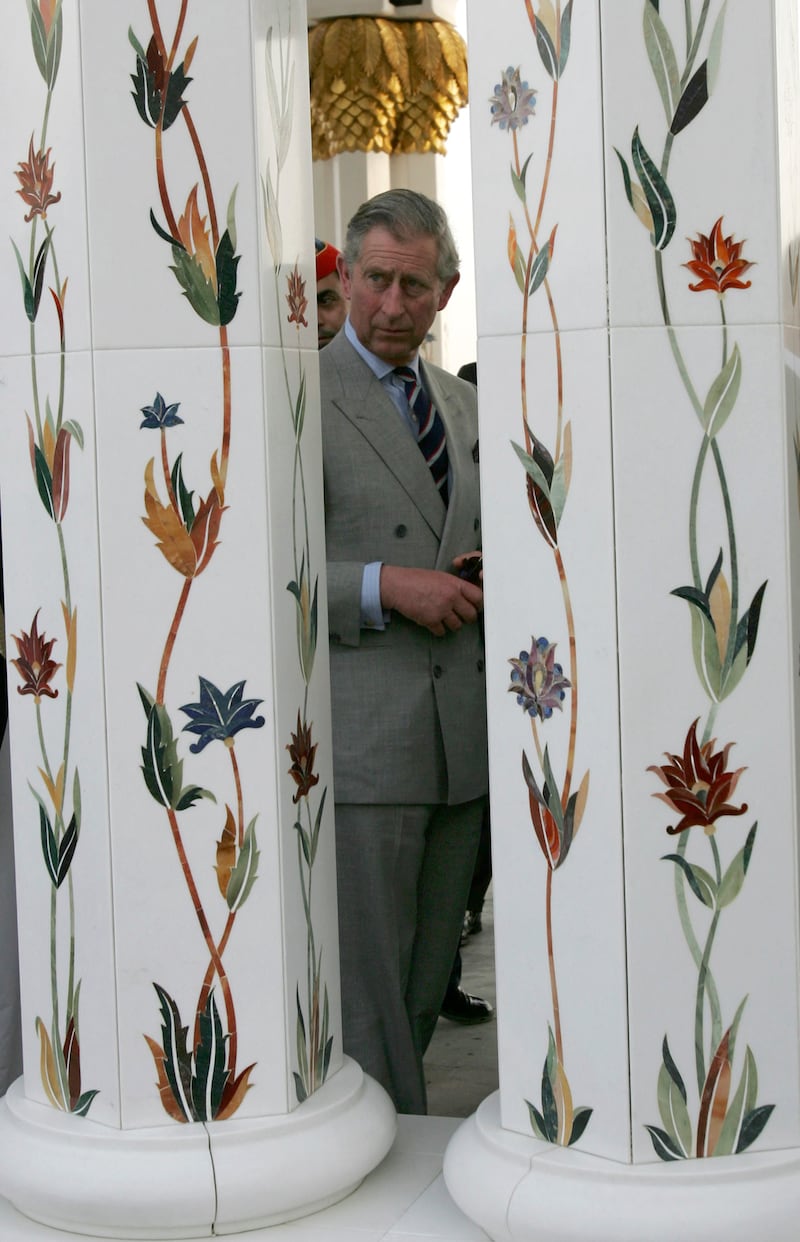 Prince Charles admires the mosque's ornate pillars. Reuters