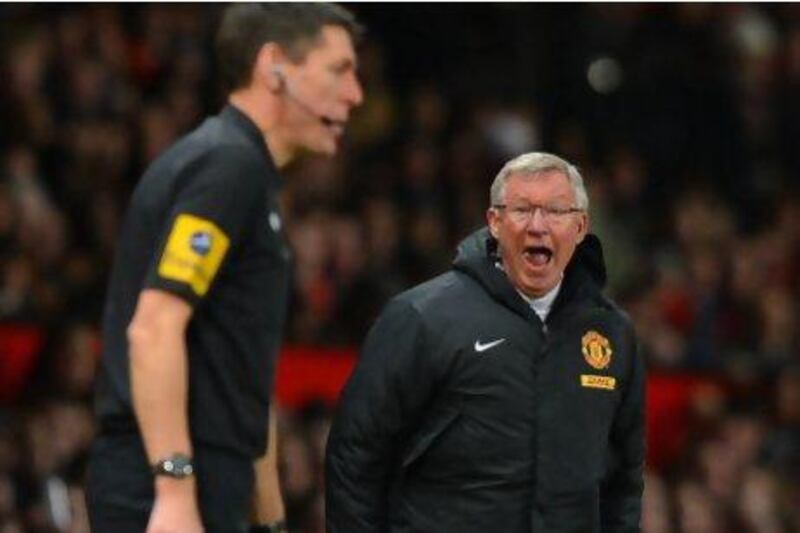 Alex Ferguson, right, may rant at referees but is strict on players if they do not give them respect. Andrew Yates / AFP