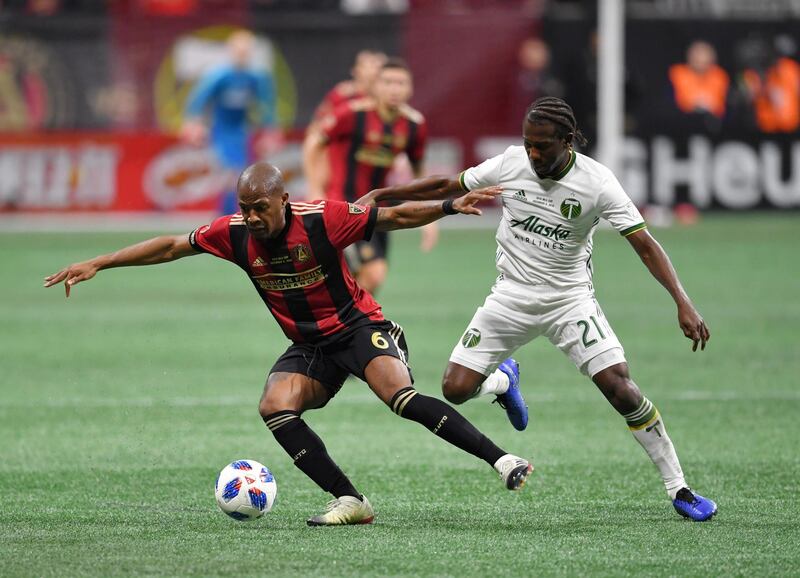 Atlanta United's Darlington Nagbe holds off Portland Timbers' Diego Chara. Reuters