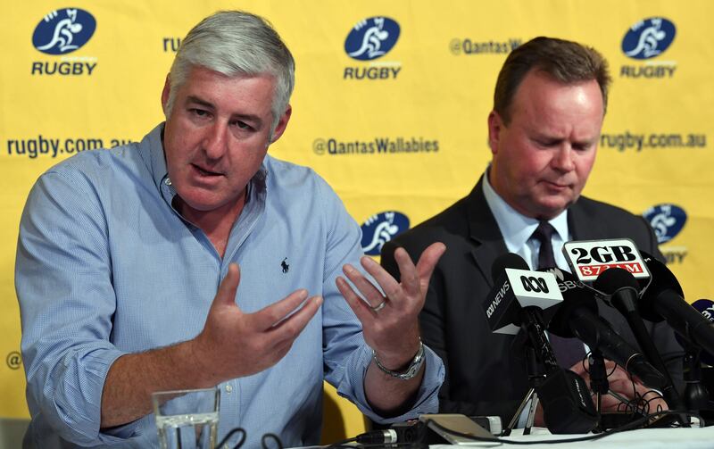 Australian Rugby Union (ARU) chairman Cameron Clyne (L) speaks as Bill Pulver (R), CEO of the ARU, looks on at a press conference at ARU headquarters in Sydney on August 11, 2017.
Australia's Western Force have been dropped from next season's Super Rugby, the Australian Rugby Union said on August 11, prompting an immediate threat of legal action by the club. / AFP PHOTO / SAEED KHAN