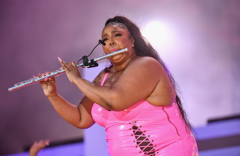 Lizzo shows off her musical talent as part of her performance. AFP