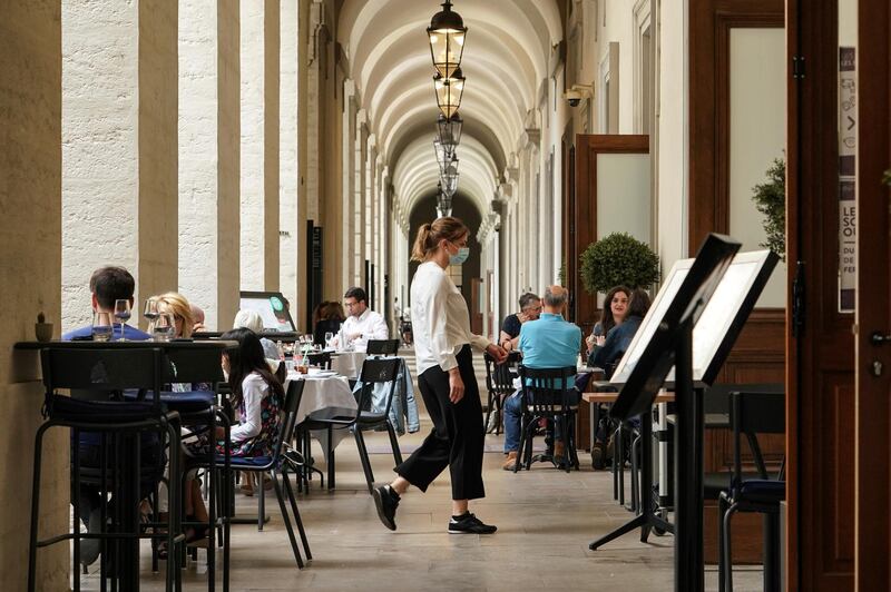 People enjoy a meal in a restaurant in Lyon, central France. AP Photo