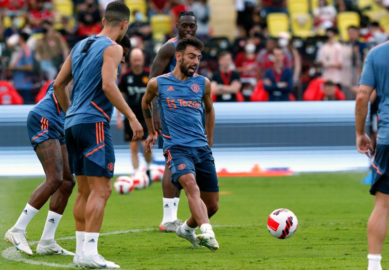 Manchester United's Bruno Fernandes, centre, and teammates during training. EPA