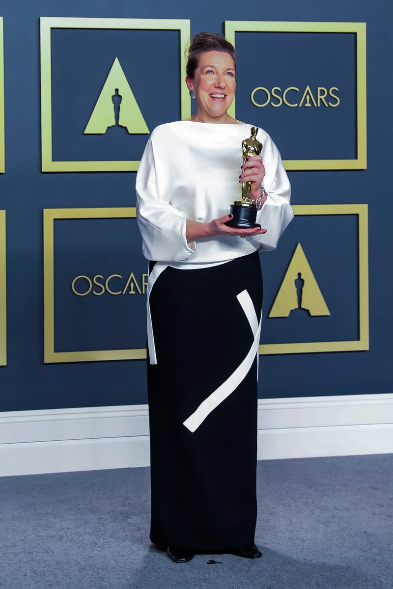 Jacqueline Durran poses in the press room with the Oscar for Costume Design for Little Women' at the 92nd Academy Awards on Sunday, February 9. EPA
