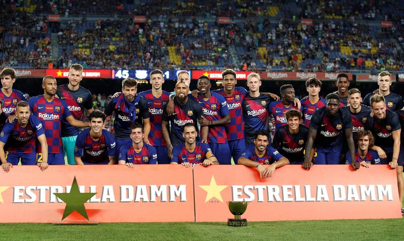 Barcelona's players pose at the end of the match. Reuters