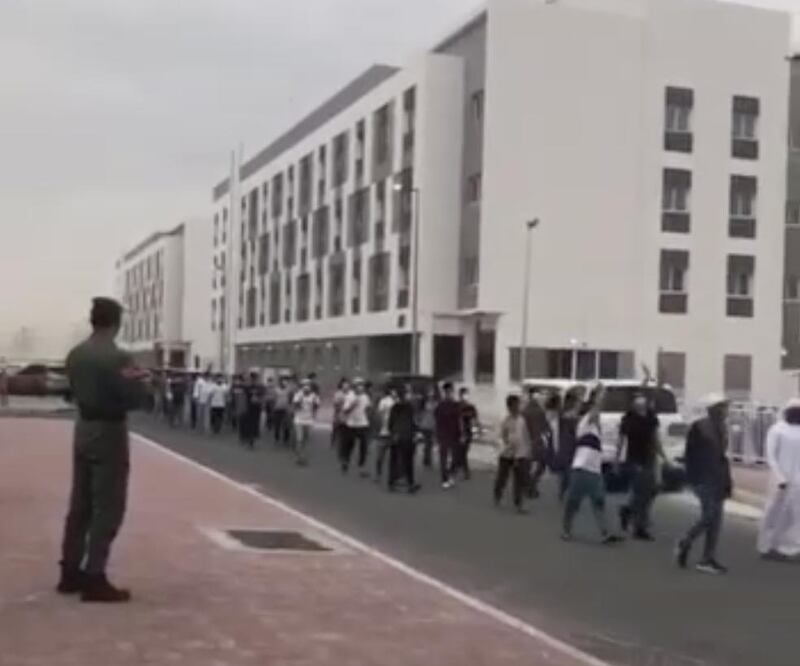 A video shared on social media shows about 150 men discharged from an isolation centre in Al Warsan, Dubai.