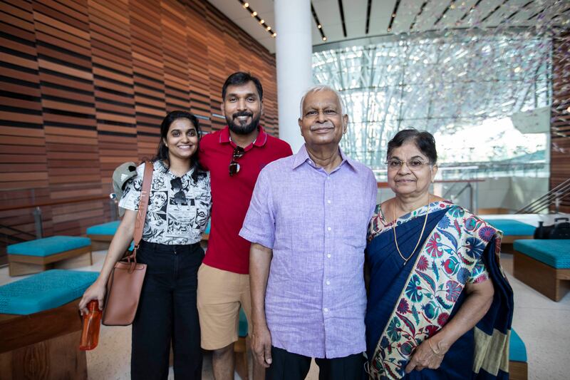 Unnikrishnan Govinad, centre, with his wife and family members inside the Sustainability pavilion.