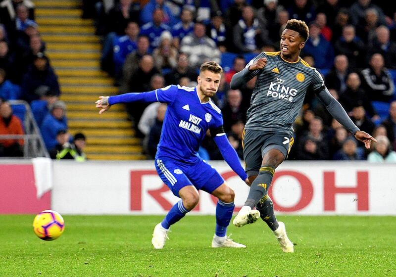 Leicester City's Demarai Gray scores his side's first goal of the game during the English Premier League soccer match between Cardiff City and Leicester City at the Cardiff City Stadium, Cardiff. Wales. AP