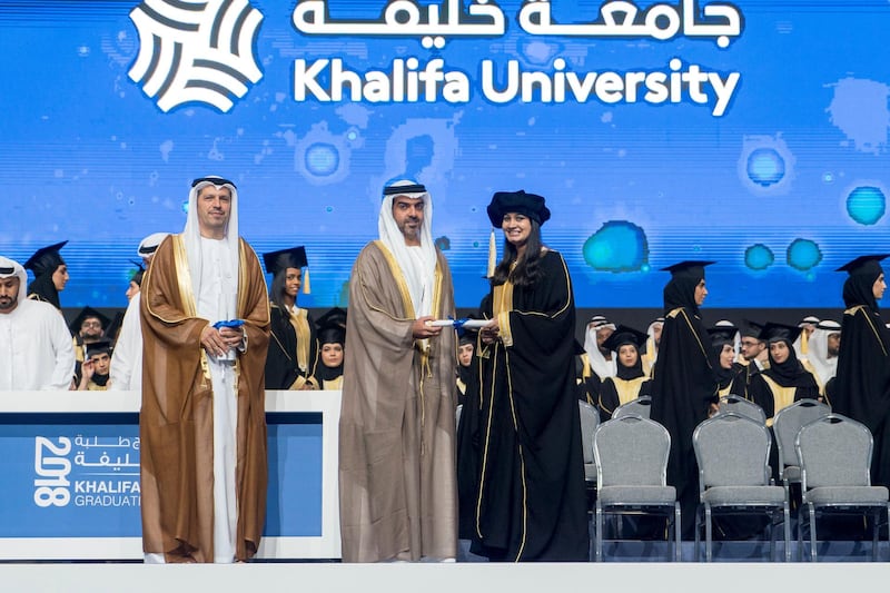 ABU DHABI, UNITED ARAB EMIRATES - October 07, 2018: HH Sheikh Hamed bin Zayed Al Nahyan, Chairman of the Crown Prince Court of Abu Dhabi and Abu Dhabi Executive Council Member (2nd L), presents a certificate to a student during the 2018 Khalifa University Graduation ceremony at the Abu Dhabi National Exhibition Centre (ADNEC). Seen with Dr. Arif Sultan Al Hammadi, Executive Vice President of Khalifa University (L).

( Rashed Al Mansoori / Crown Prince Court - Abu Dhabi )
---
