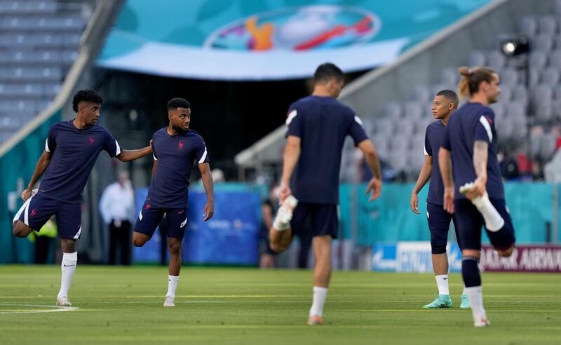 Kingsley Coman, left, and Kylian Mbappe talk during a team training session at Allianz Arena. AP