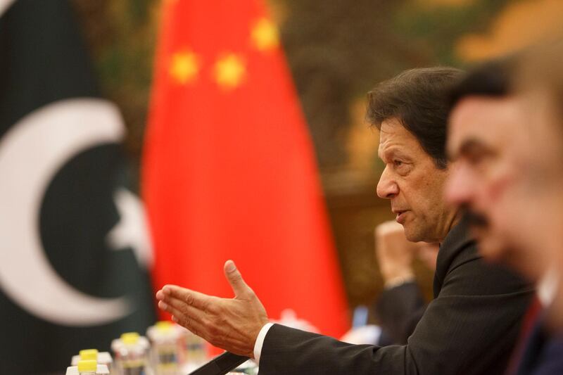 Pakistan's Prime Minister Imran Khan (2nd R) attends talks with China's President Xi Jinping (not pictured) at the Great Hall of the People in Beijing.  AFP