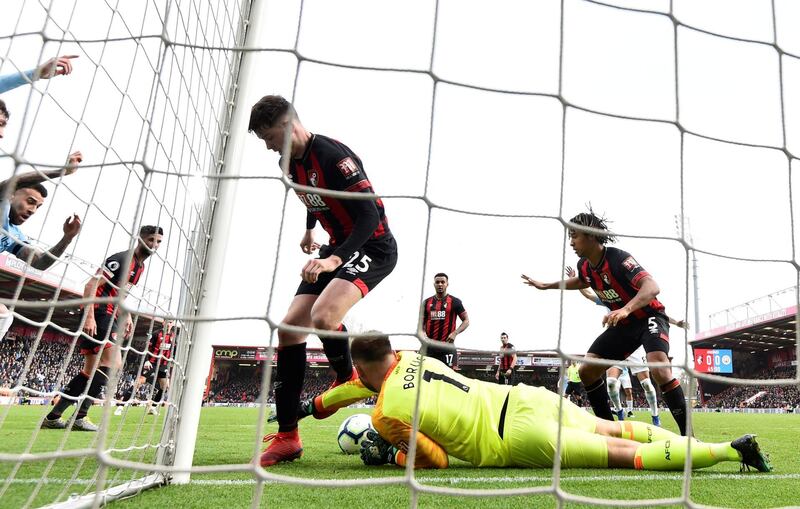 Boruc and Jack Simpson in action. Reuters