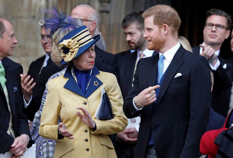 Prince Harry, Duke of Sussex, talks with his aunt, Princess Anne, Princess Royal, as they leave St George's Chapel. AFP