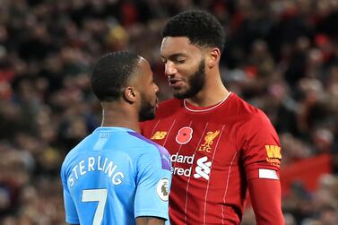 Liverpool's Joe Gomez (right) and Manchester City's Raheem Sterling clash during the Premier League match at Anfield. PA