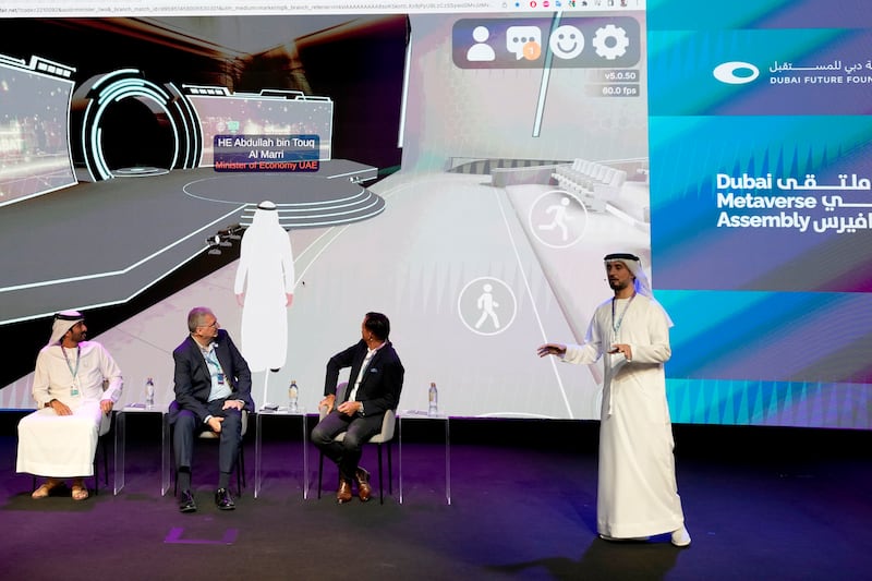 Khalifa AlJaziri, the UAE Ministry of Economy's metaverse lead, demonstrating the ministry's new metaverse headquarters at the Dubai Metaverse Assembly on Wednesday. AP