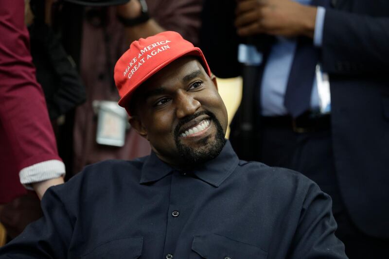 Rapper Kanye West wears a Make America Great again hat during a meeting with President Donald Trump in the Oval Office of the White House in Washington. AP