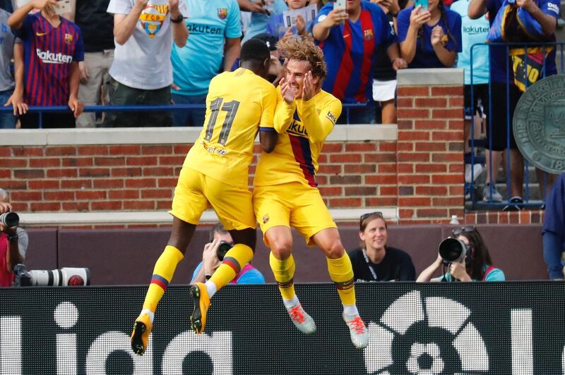 Ousmane Dembele, left, celebrates his goal with Griezmann. Reuters