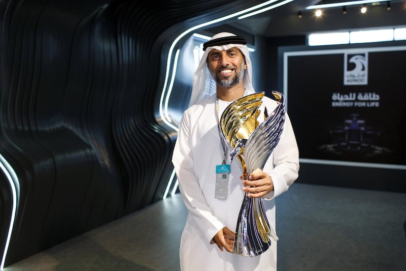 Suhail Al Mazrouei, Minister of Energy and Industry, holds the new F1 trophy which will be unveiled at the Abu Dhabi Grand Prix